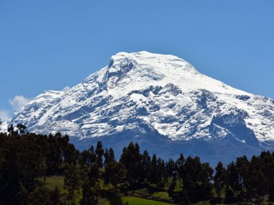 The glacier-capped Cayambe volcano rises above the Ecuadorean Andes.   This mountain is the only place on the Equator that is permanently covered by ice & snow.